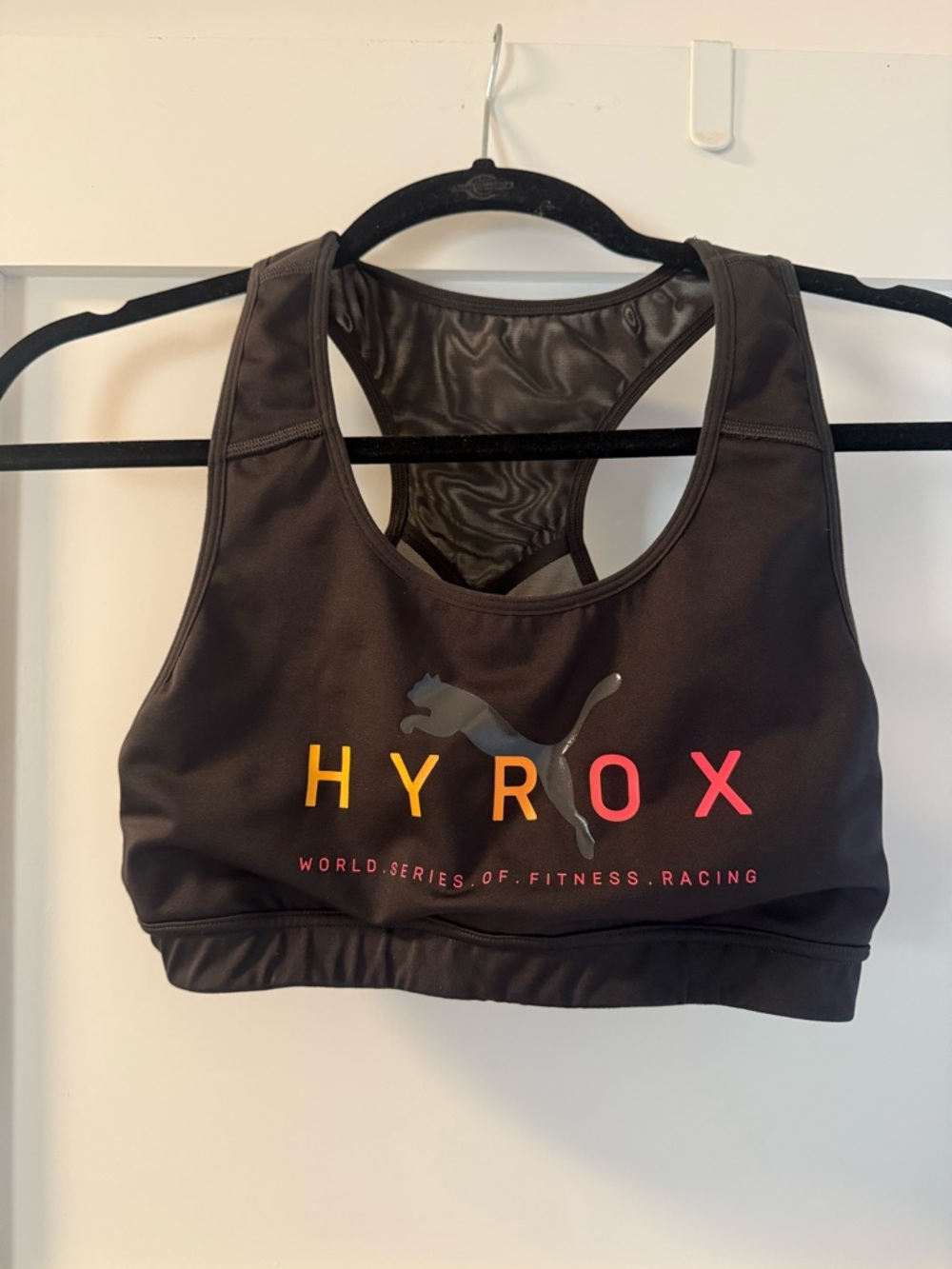 Puma HYROX Black Sports Bra with Pink and Orange Logo